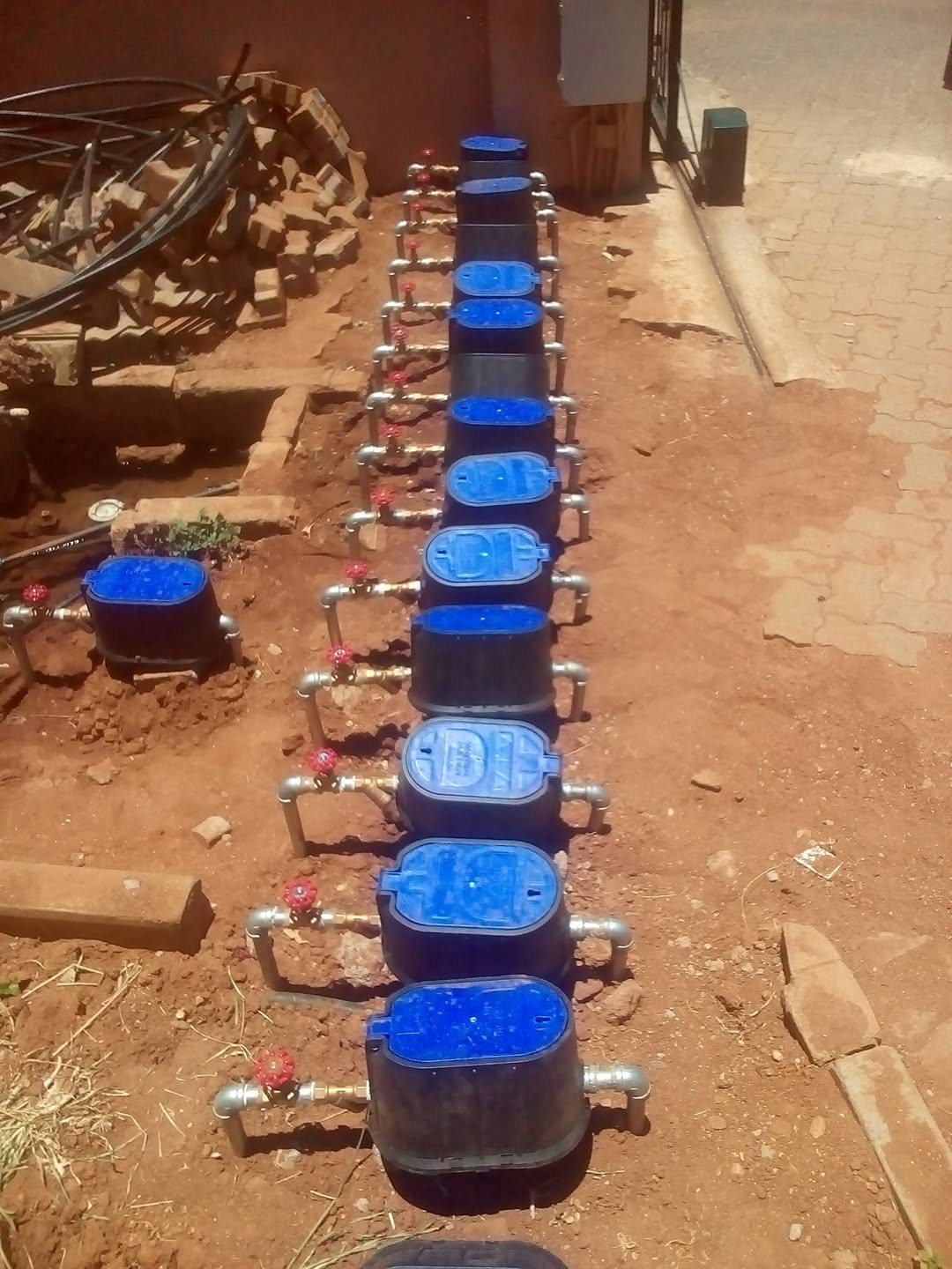 A row of prepaid water meters installed at a multi-unit property