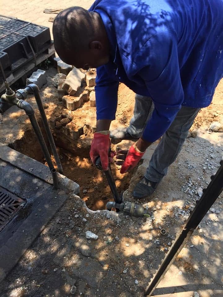 FactorFast technician connecting a meter to the supply line